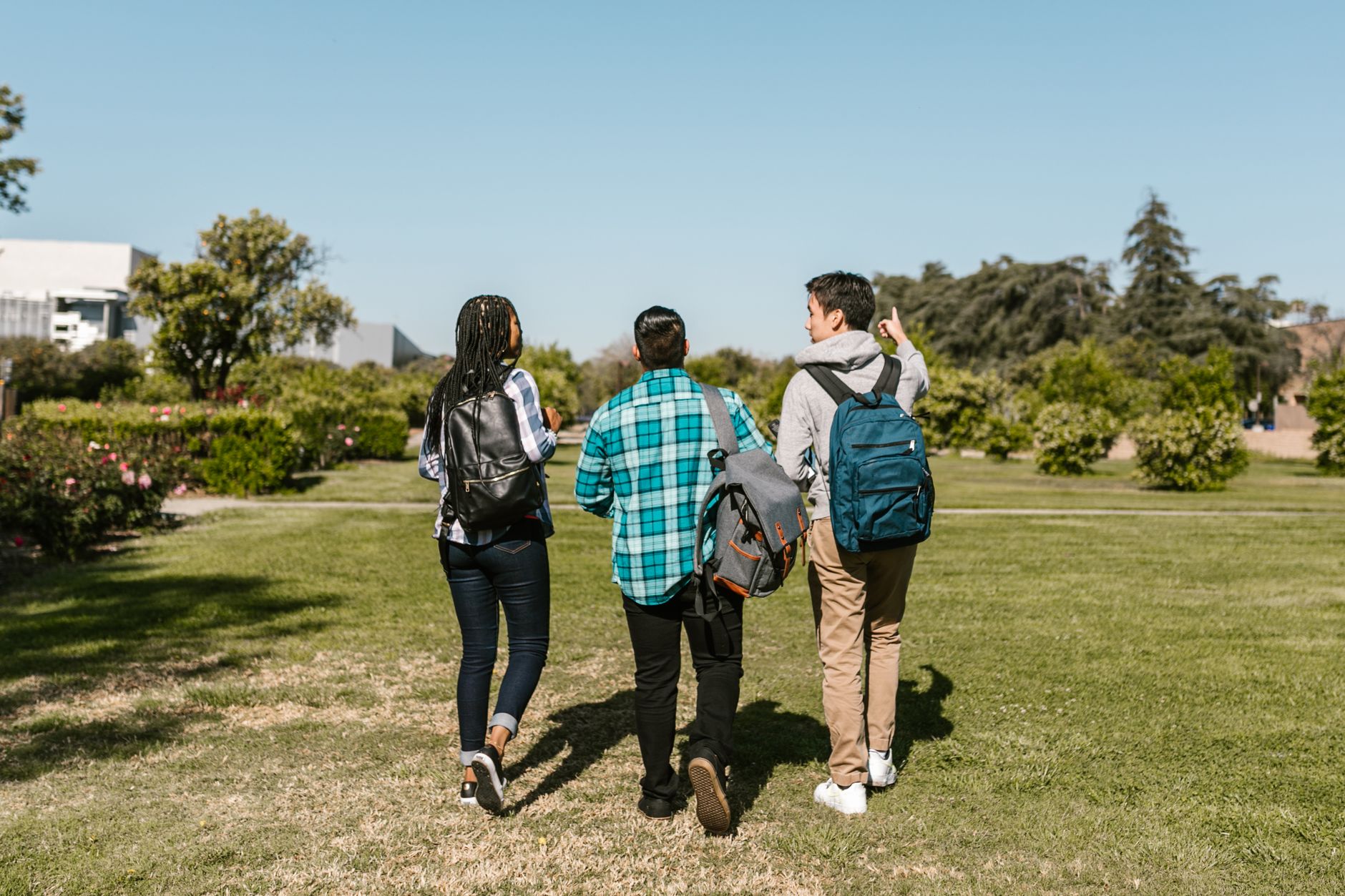International students walking outside modern university campus buildings in New Zealand