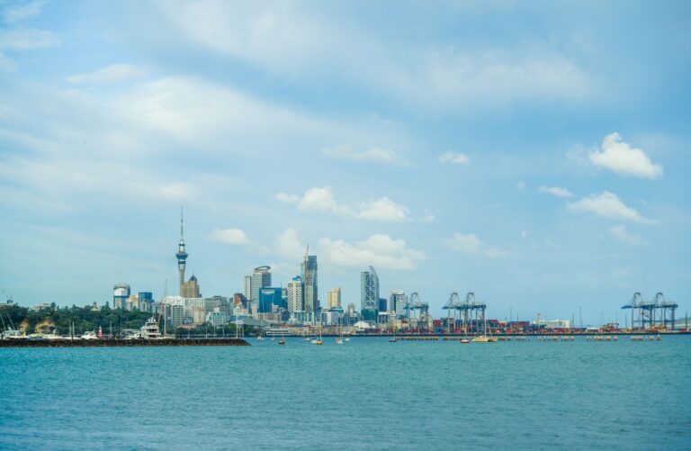 Modern office buildings in Auckland New Zealand showcasing the thriving business district funded by global investment.