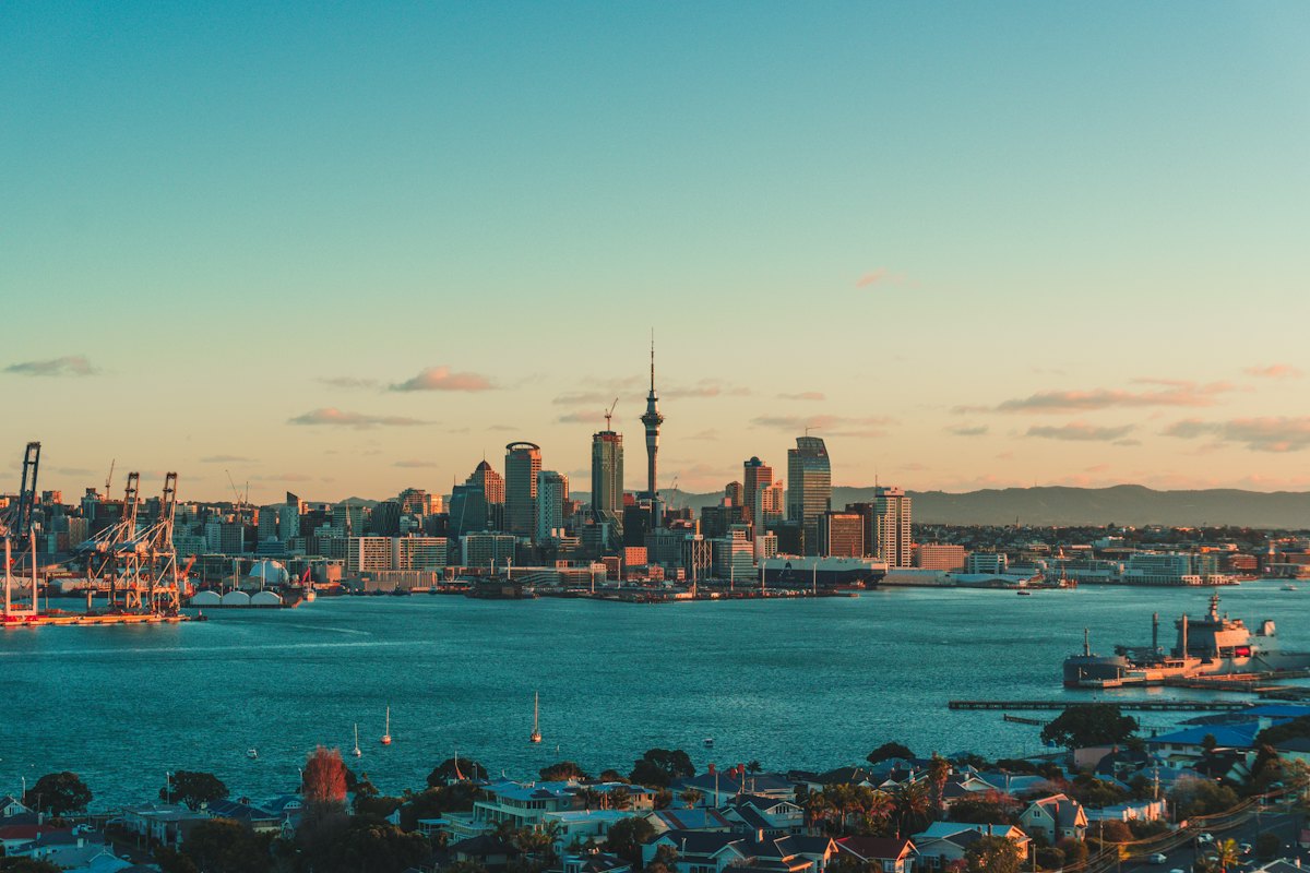 The Auckland skyline and harbour at sunset, with the Sky Tower, New Zealand